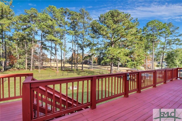 wooden deck with a yard