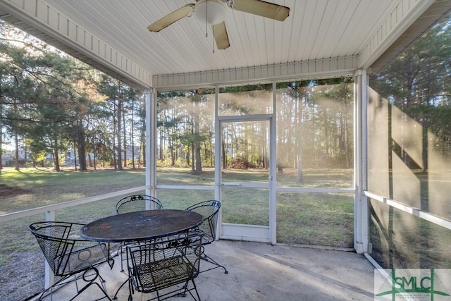 sunroom with plenty of natural light and ceiling fan