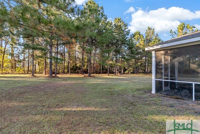 view of yard with a sunroom