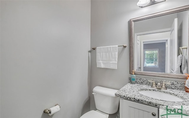 bathroom with vanity and toilet