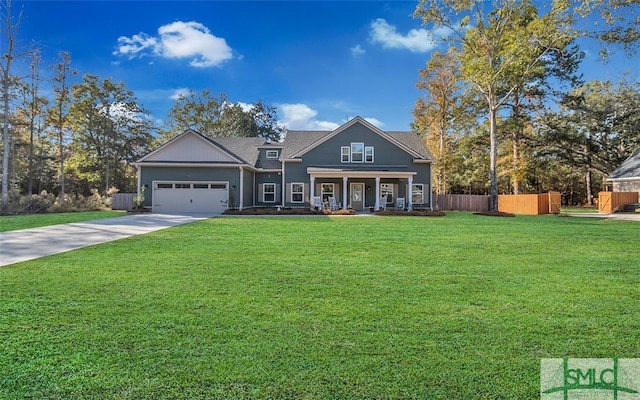 view of front facade featuring a front yard, a porch, and a garage