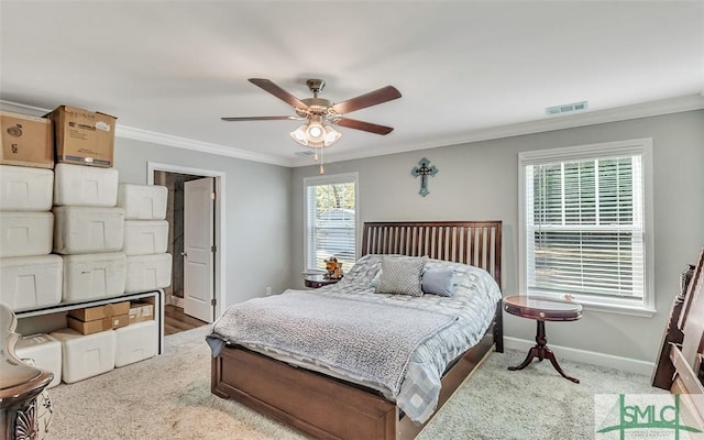 bedroom with carpet flooring, ceiling fan, and crown molding