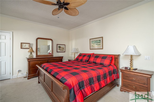 carpeted bedroom featuring ceiling fan, a textured ceiling, and ornamental molding