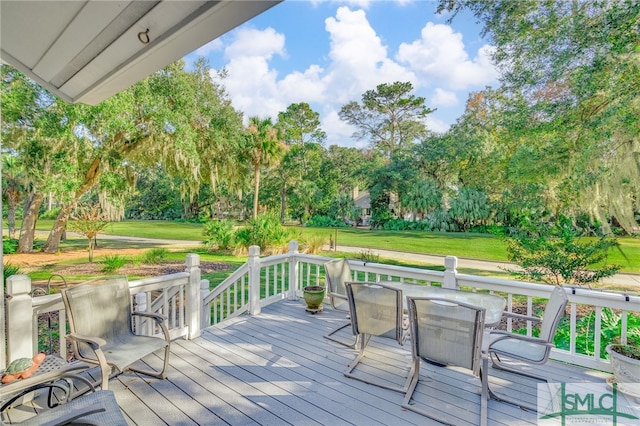 wooden deck with a yard