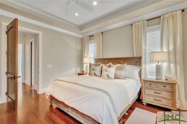 bedroom featuring ceiling fan and wood-type flooring