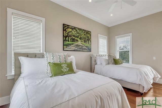 bedroom with hardwood / wood-style floors and ceiling fan