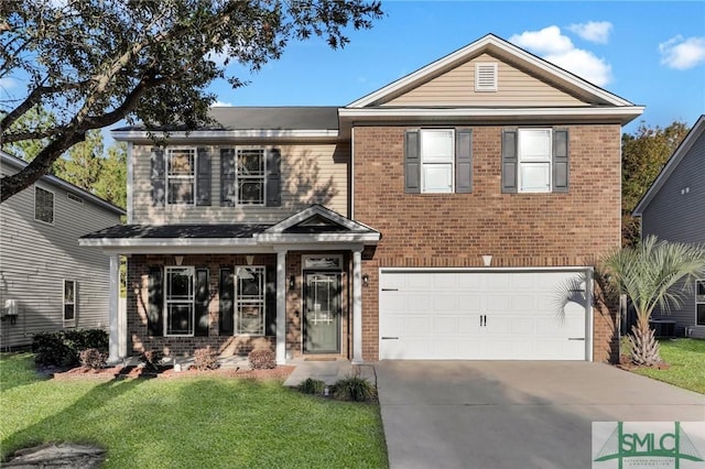 view of front of house featuring a front yard and a garage