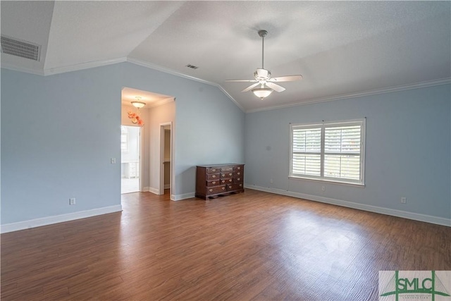 empty room featuring ceiling fan, lofted ceiling, dark wood-type flooring, and ornamental molding