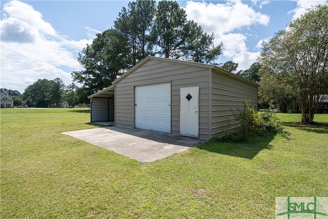 garage featuring a yard