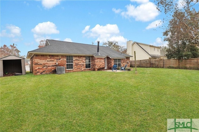 back of property featuring a yard, a patio, and central AC unit