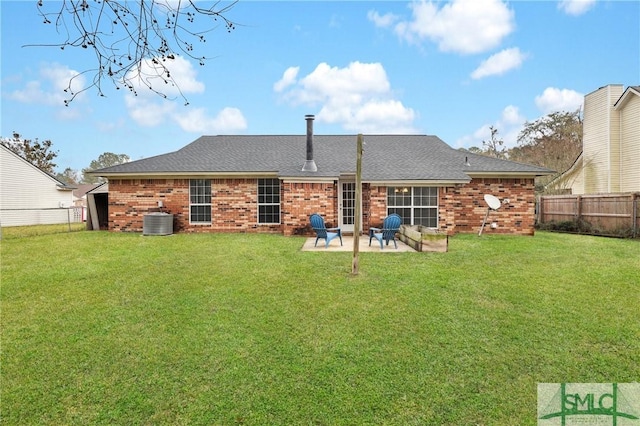 rear view of house featuring central AC unit, a patio area, and a yard