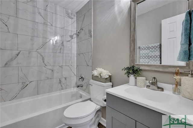 full bathroom featuring vanity, toilet, and tiled shower / bath