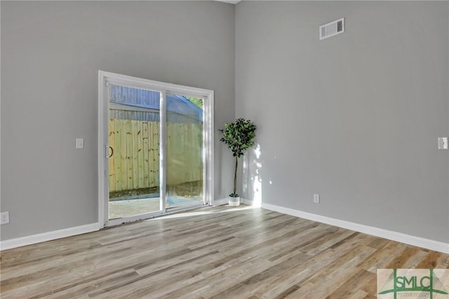 spare room featuring light wood-type flooring