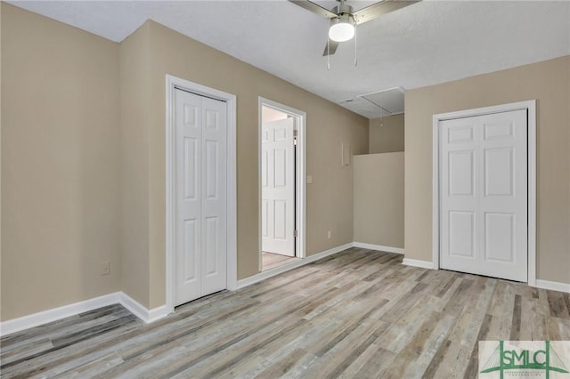 unfurnished bedroom with ceiling fan and light hardwood / wood-style flooring