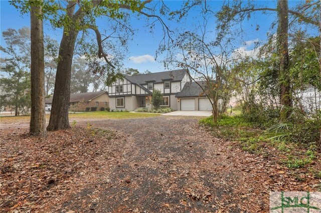 tudor home featuring a garage