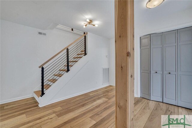 stairway featuring hardwood / wood-style flooring