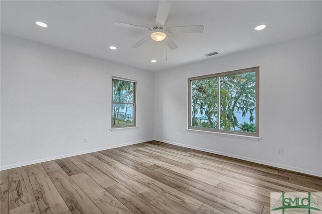 unfurnished room featuring ceiling fan and light hardwood / wood-style floors