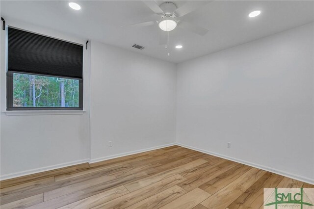 unfurnished room with ceiling fan and light hardwood / wood-style floors