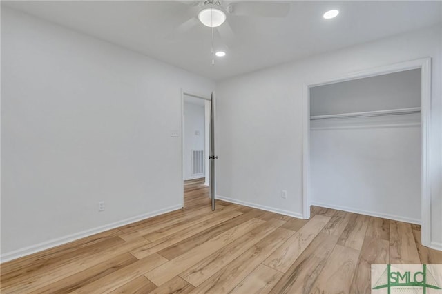 unfurnished bedroom featuring a closet, ceiling fan, and light hardwood / wood-style flooring