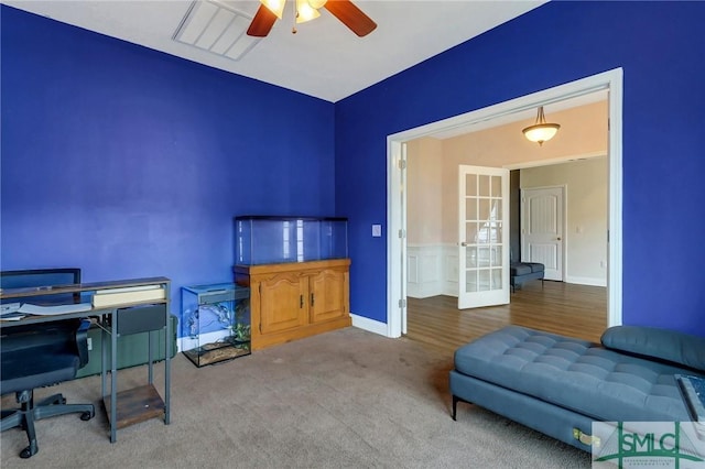 office space featuring ceiling fan, carpet floors, and french doors