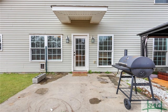 property entrance featuring a patio