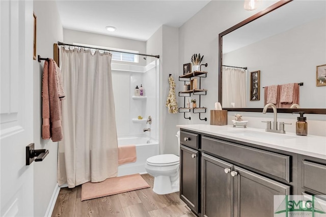 full bathroom with toilet, vanity, shower / bath combo, and hardwood / wood-style flooring