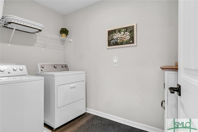 washroom with separate washer and dryer and dark wood-type flooring