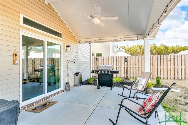 view of patio featuring a grill and ceiling fan