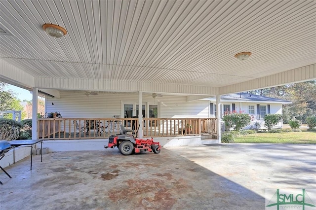 view of patio featuring ceiling fan and a porch