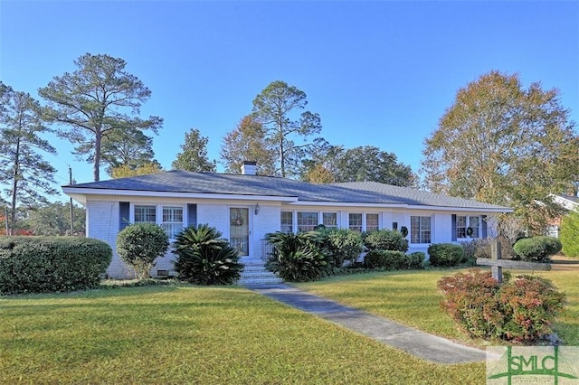 ranch-style house with a front yard