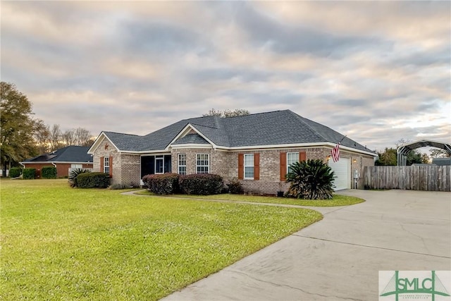 ranch-style home featuring a front yard and a garage