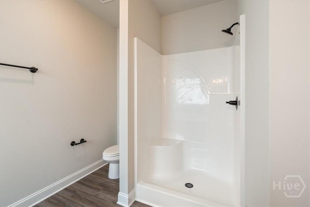 287 Timberlake Dr, Guyton, GA 31312 - full bath with toilet, a shower, wood finished floors, and baseboards