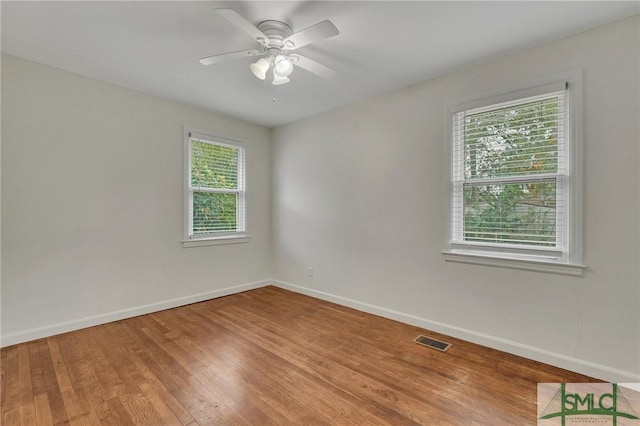 spare room featuring ceiling fan and wood-type flooring