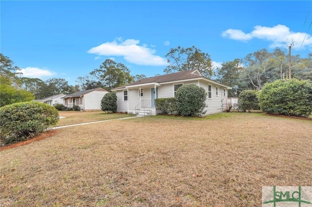 ranch-style house featuring a front lawn