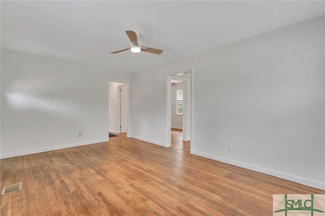 empty room featuring ceiling fan and light wood-type flooring