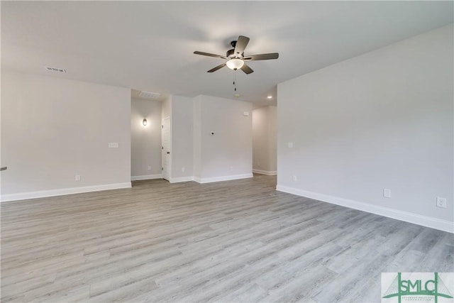 spare room with light hardwood / wood-style floors and ceiling fan