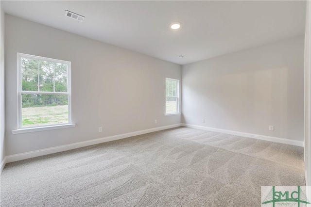 unfurnished room featuring carpet flooring