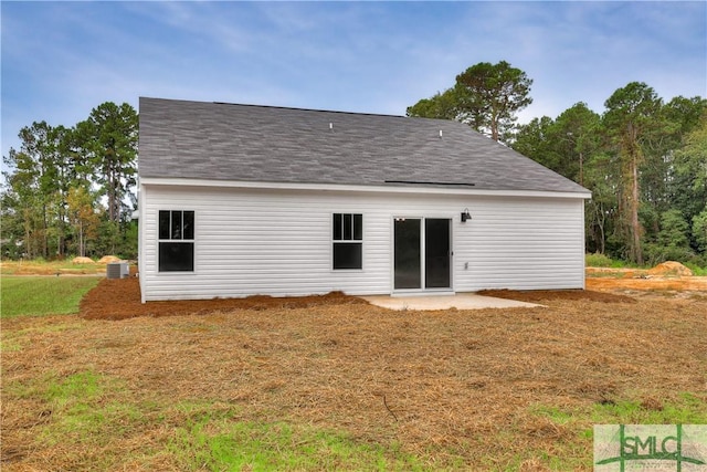 rear view of property featuring cooling unit