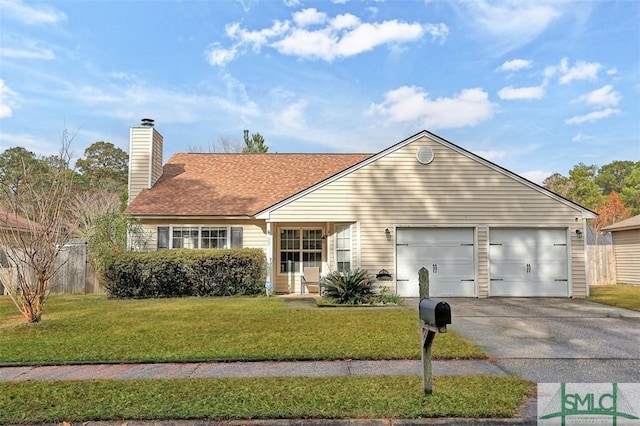 ranch-style home featuring a front yard and a garage