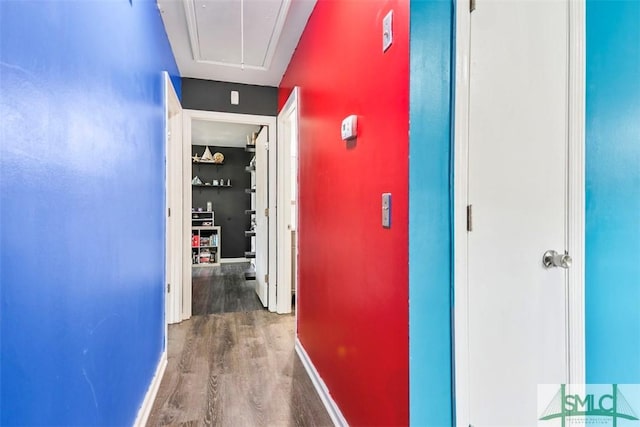 hallway with hardwood / wood-style flooring