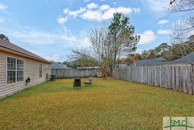 view of yard with central AC