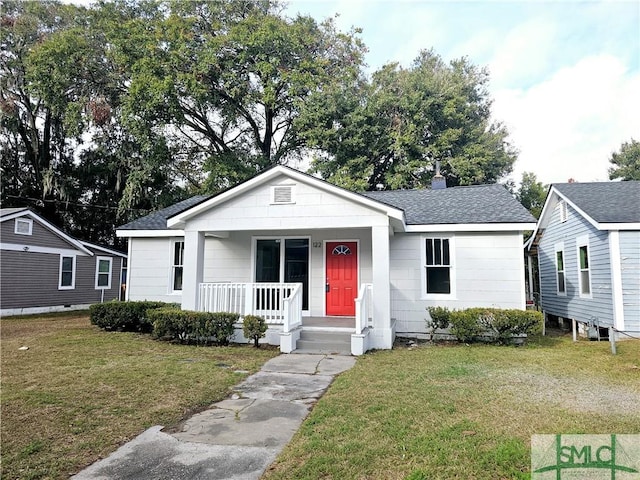 view of front of house with a front lawn and a porch