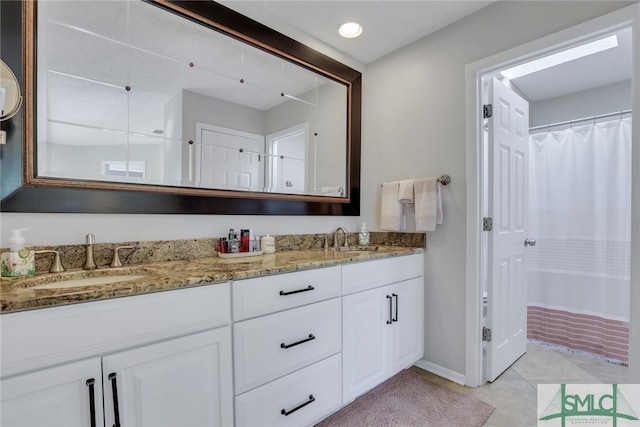 bathroom featuring tile patterned floors, vanity, and a shower with shower curtain