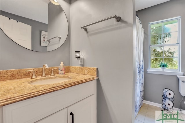 bathroom with curtained shower, tile patterned flooring, and vanity