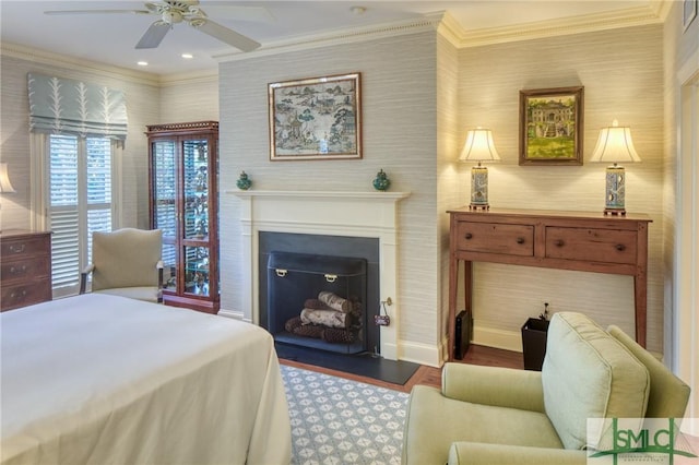 bedroom featuring dark hardwood / wood-style floors, ceiling fan, and crown molding