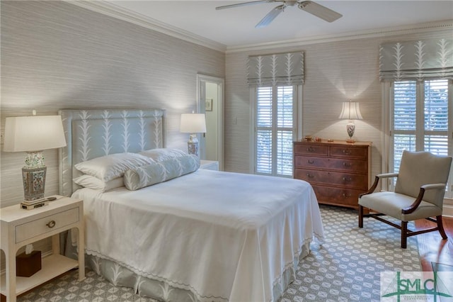 bedroom featuring multiple windows, ceiling fan, and crown molding