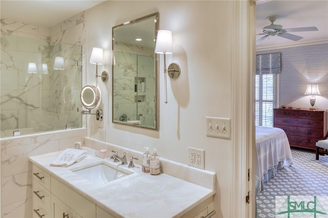 bathroom with ceiling fan, a shower with door, ornamental molding, and vanity