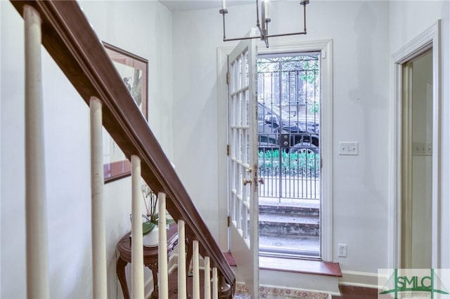 entrance foyer with a chandelier