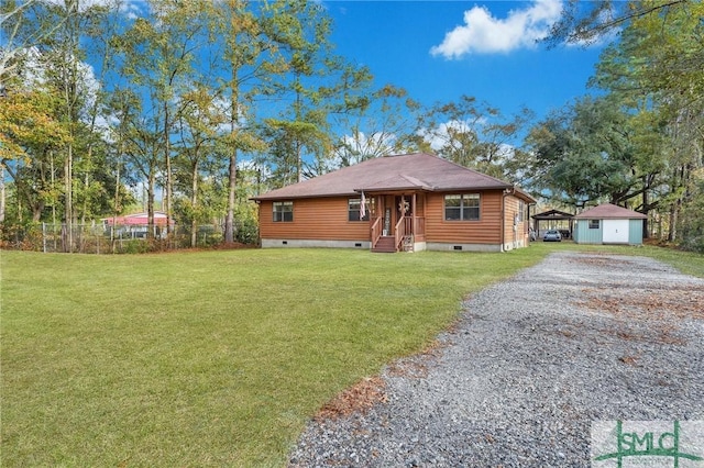 view of front of house with a front lawn and an outdoor structure