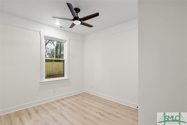 unfurnished room with ceiling fan and light wood-type flooring